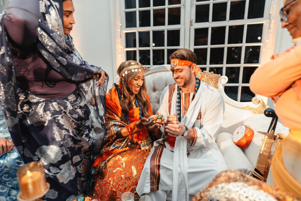 Sudanese wedding tradition of exchanging dates and sweets during a cultural wedding at Kew Gardens