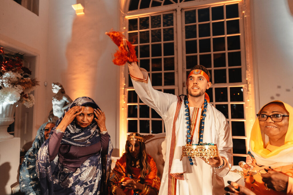 Sudanese wedding tradition of exchanging dates and sweets during a cultural wedding at Kew Gardens