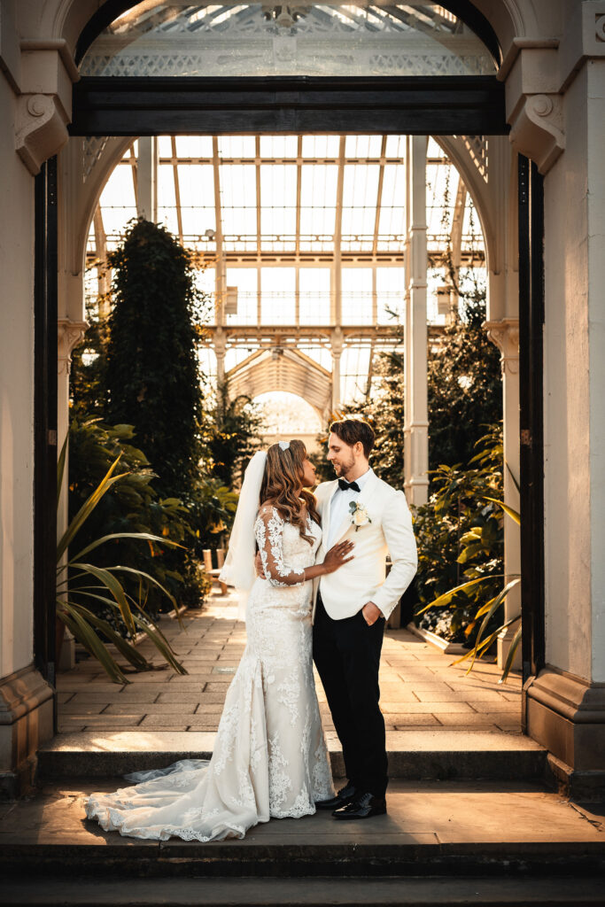 Sudanese wedding couple portraits inside Temperate House at Kew Gardens captured by a London wedding photographer