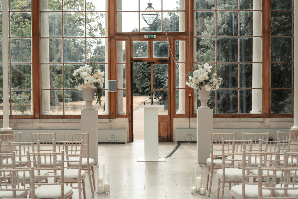 Sudanese wedding ceremony at Nash Conservatory in Kew Gardens with natural sunlight streaming through glass walls