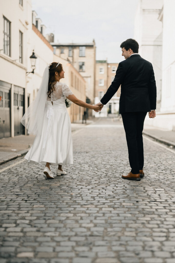 Marylebone Town Hall wedding photography of couple walking in London