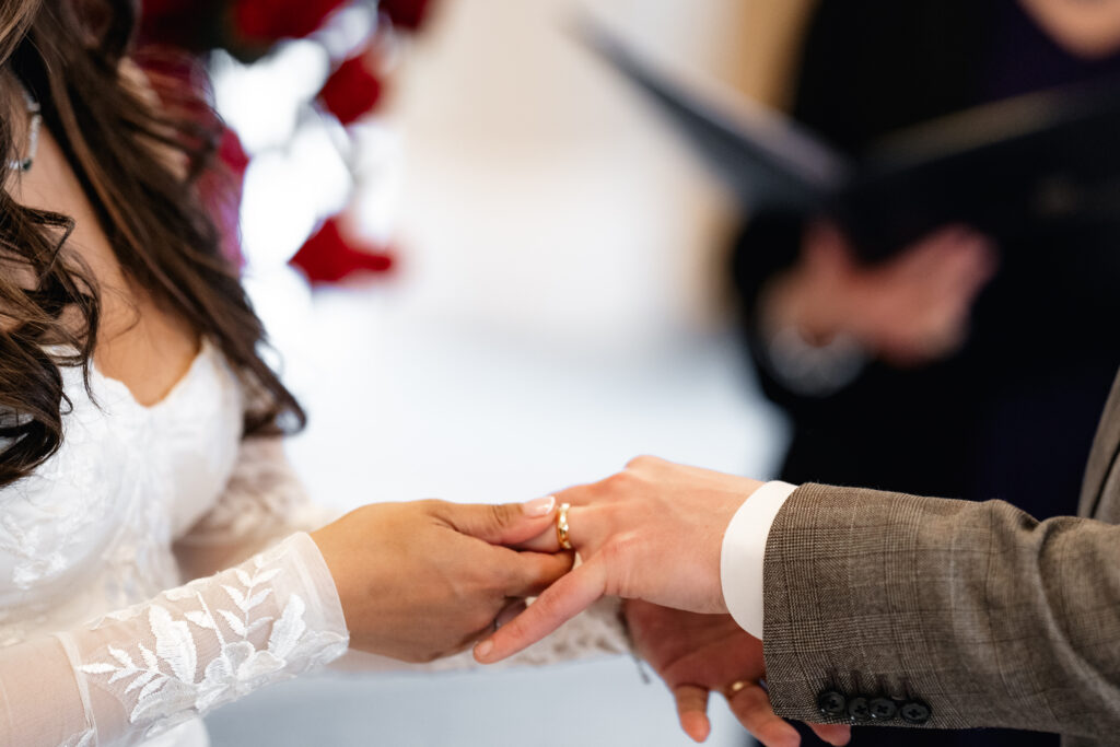 bride and groom exchanging rings at the landmark hotel london