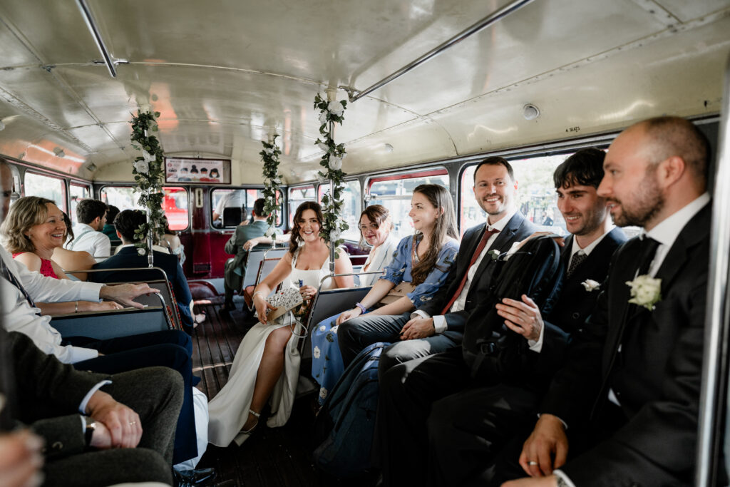 Traditional London wedding bus travelling through Islington streets