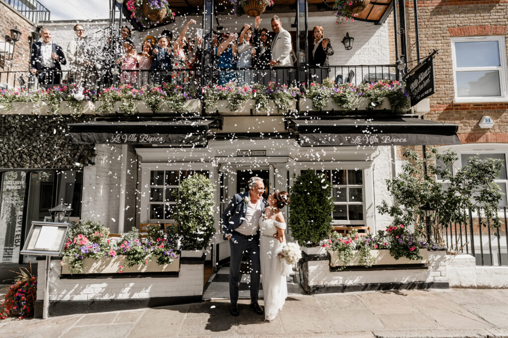 Bride and groom beneath confetti at Villa Bianca Hampstead