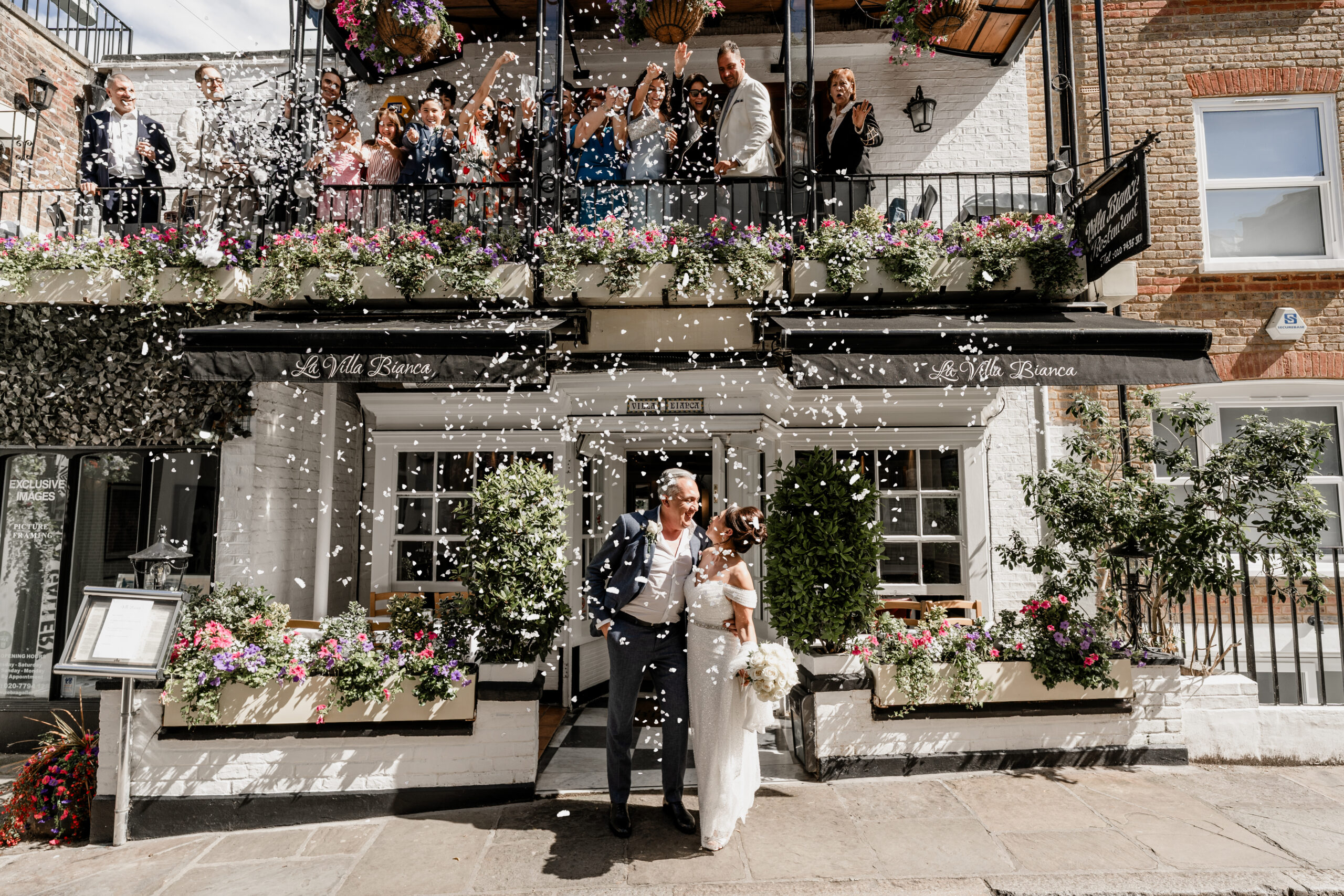 Balcony confetti moment at Villa Bianca restaurant