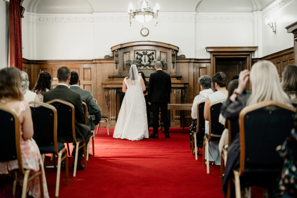 Islington Town Hall wedding ceremony room with couple exchanging vows
