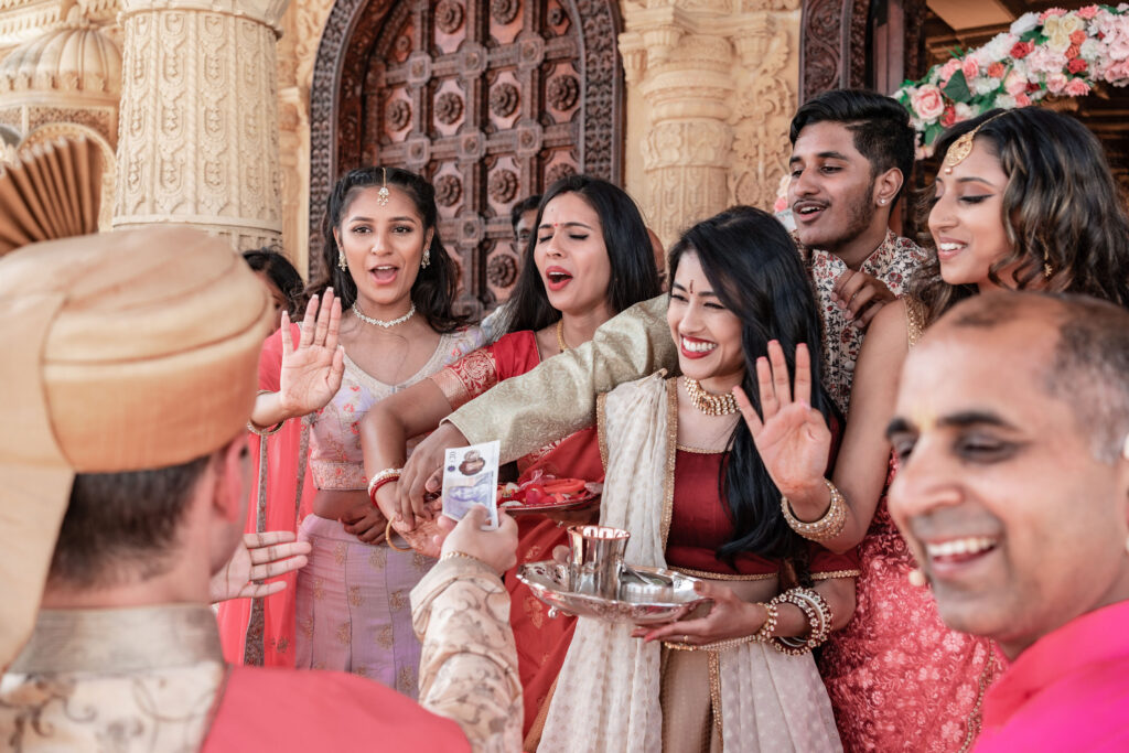 Family welcoming groom at temple wedding