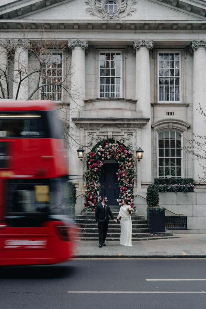 Bride and groom outside Chelsea Town Hall during a winter wedding