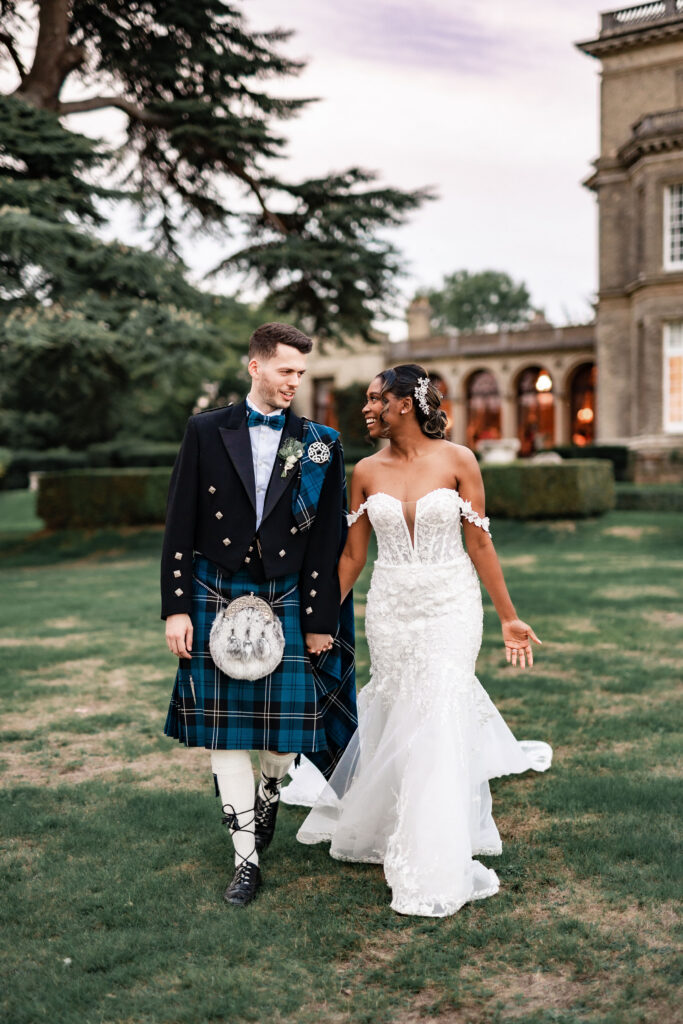 Scottish groom wearing traditional Highland kilt at Hedsor House