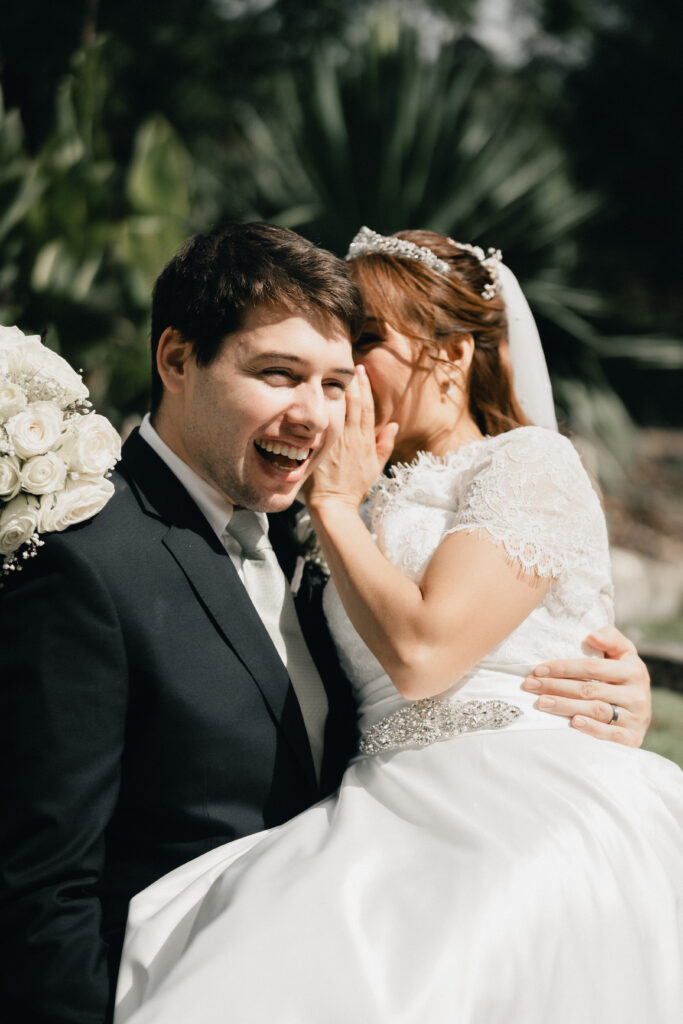 Bride and groom sharing genuine moments during portraits