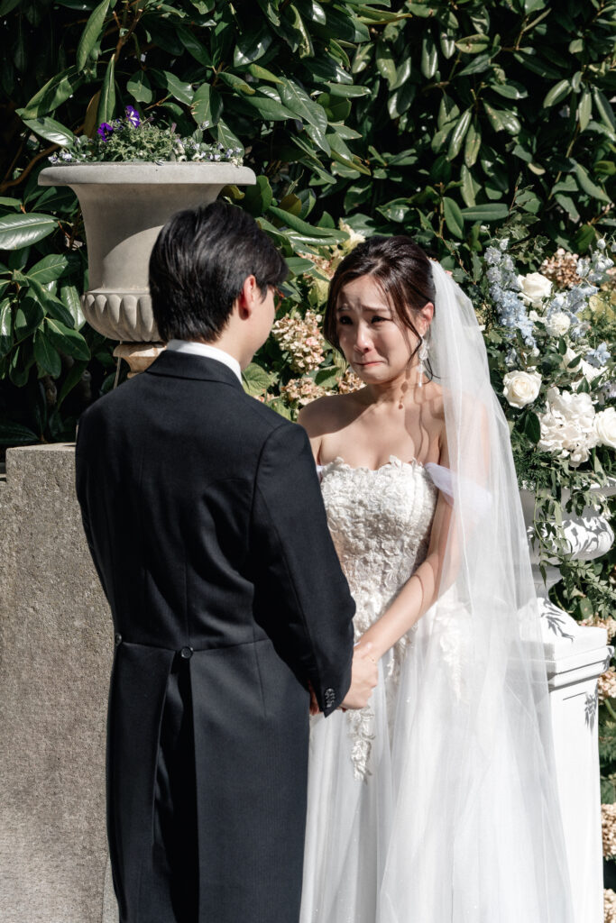 Eugene and Cheryl during their outdoor wedding ceremony at Hedsor House